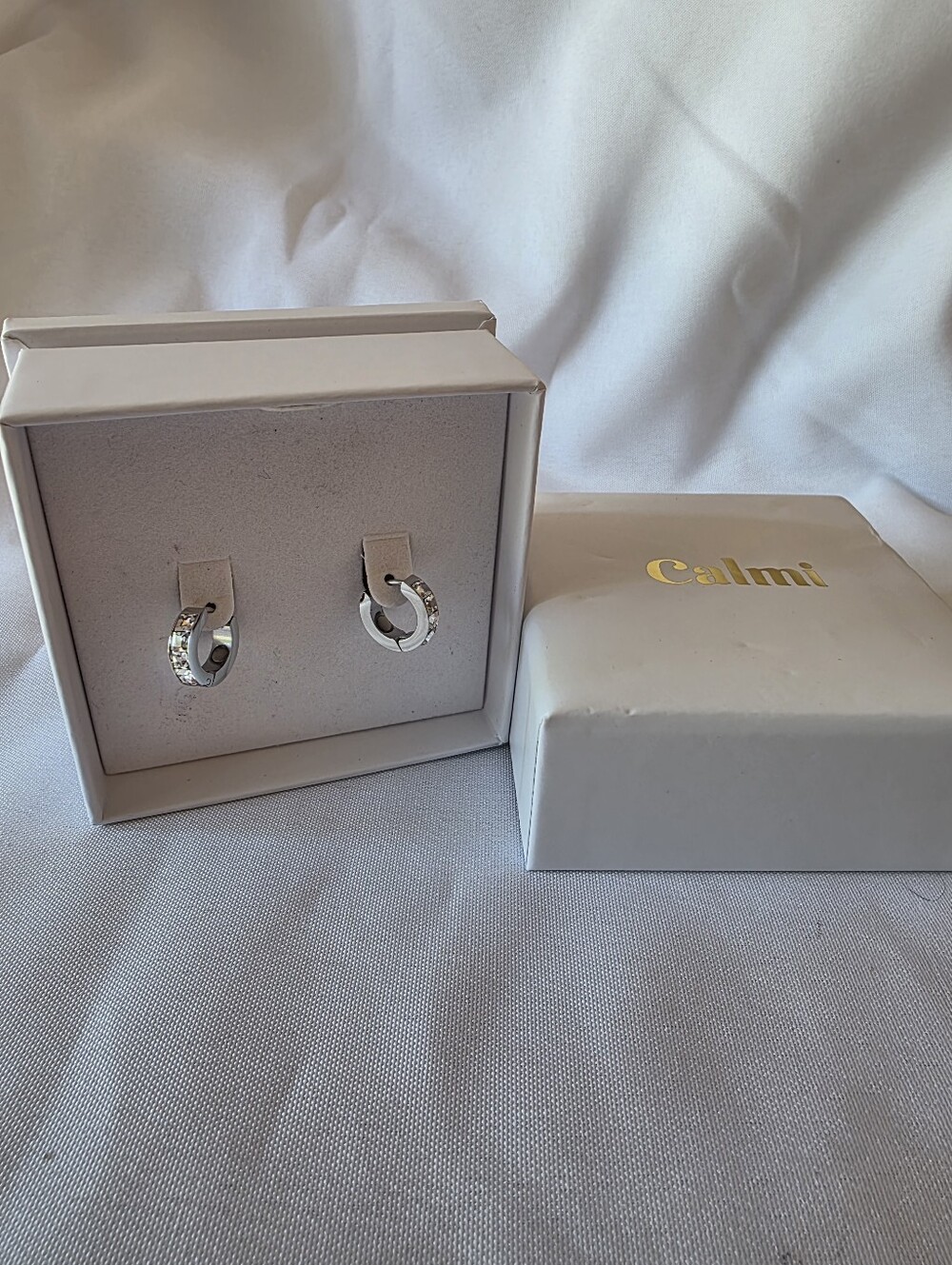 New Calmi Silver Tone Clear Rhinestone Accupressure Relief Huggie Hoops